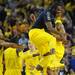 Michigan fifth-year senior Corey Person celebrates with sophomore Trey Burke after Burke's steal and basket late in the second half against Michigan State at Crisler Center on Sunday, March 3, 2013. Melanie Maxwell I AnnArbor.com